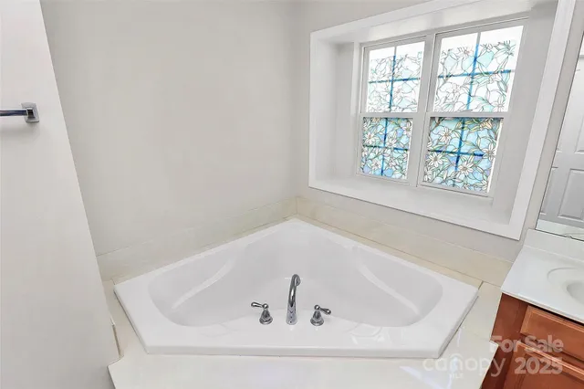 a white bath tub sitting in a bathroom