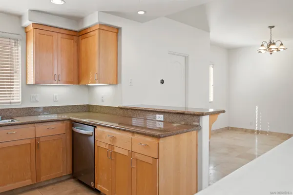 a kitchen with cabinets appliances and a sink