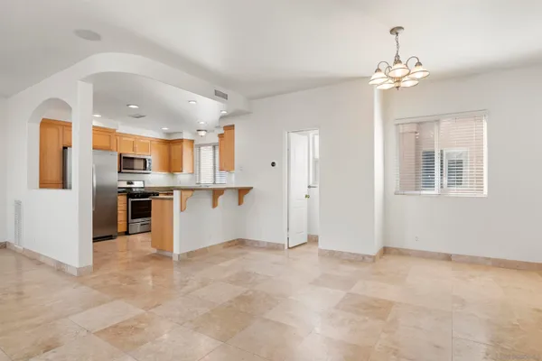 a view of a kitchen with a sink and cabinets