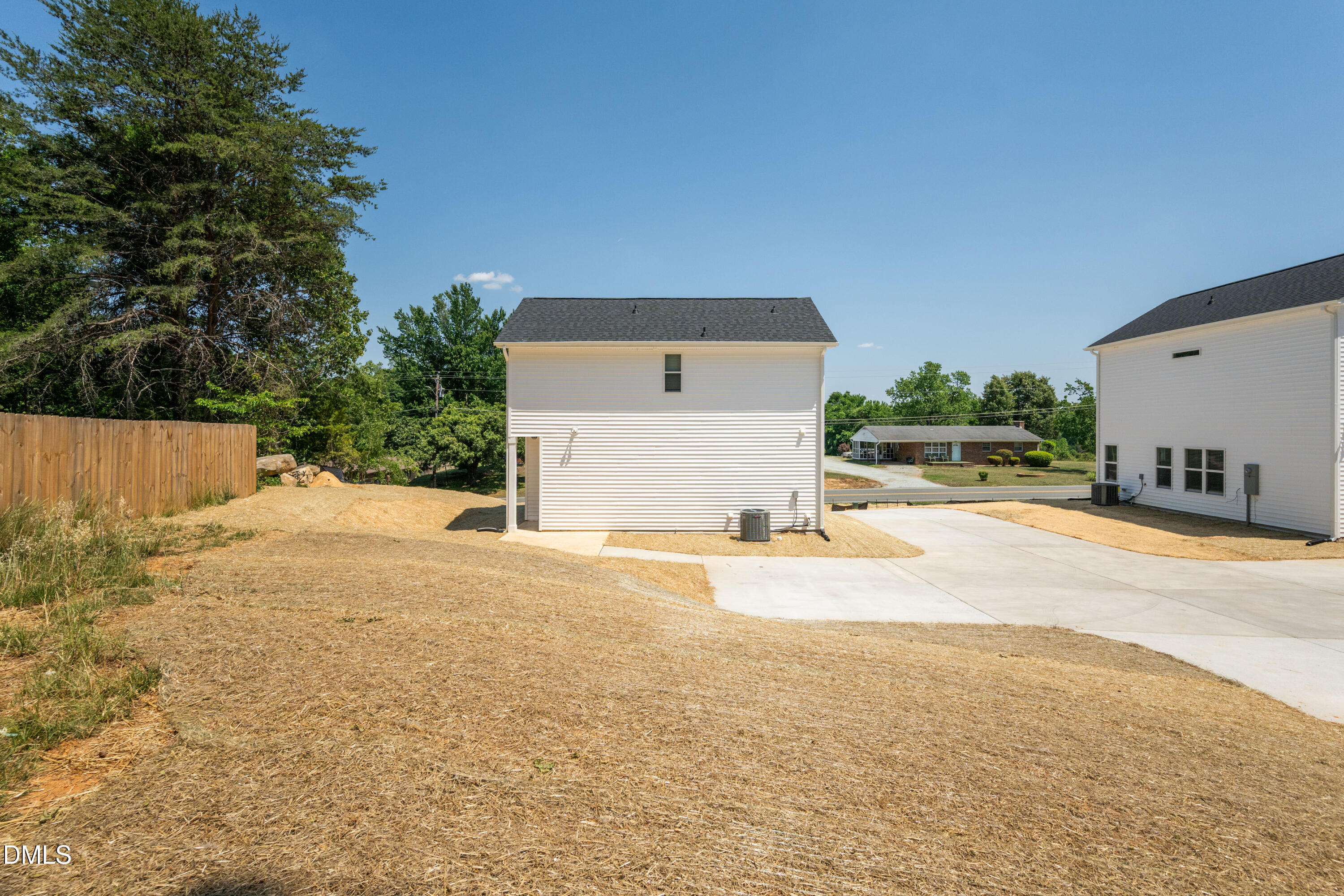 1182 Hurdle Mills Road Roxboro, NC 27573 - Photo 39 of 45 a front view of a house with a yard and garage