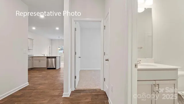 a bathroom with a sink a mirror and a shower