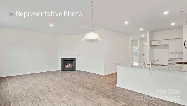 a view of a kitchen with a sink and a stove