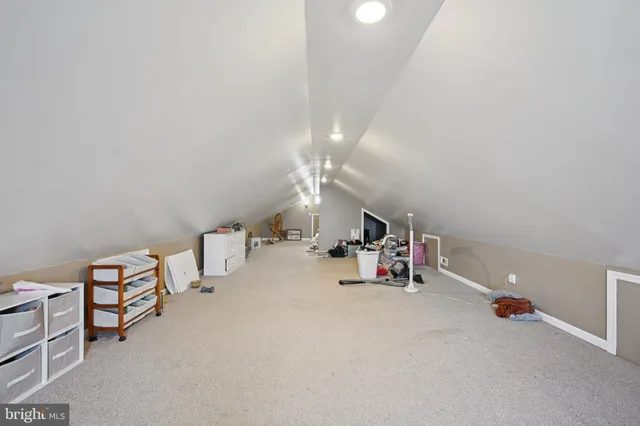 a view of livingroom with dining room and natural light