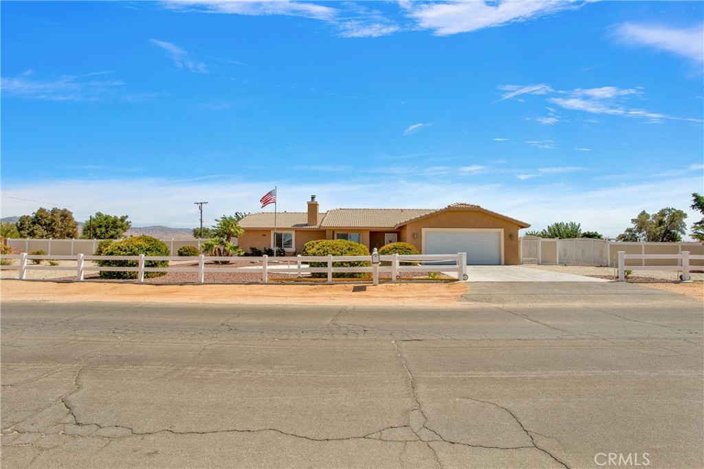 22085 Pahute Road Apple Valley, CA 92308 - Photo 1 of 1 a view of a city street with a house