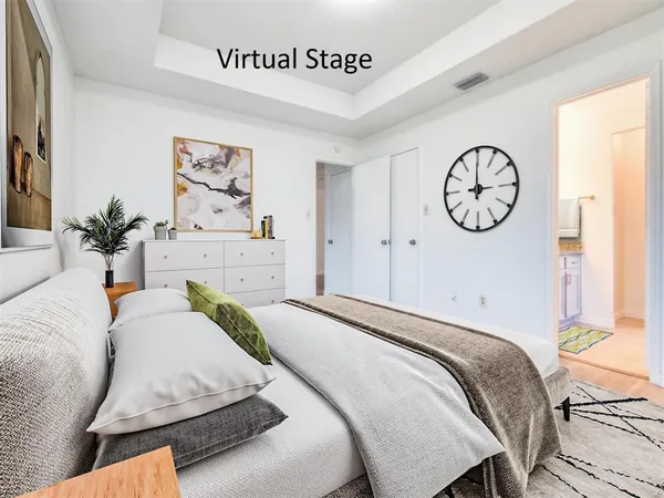 a bedroom with a bed and a table in it