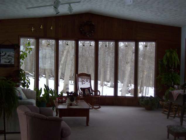 620 East Reusch Road Elizabeth, IL 61028 - Photo 5 of 8 a living room with furniture and floor to ceiling window