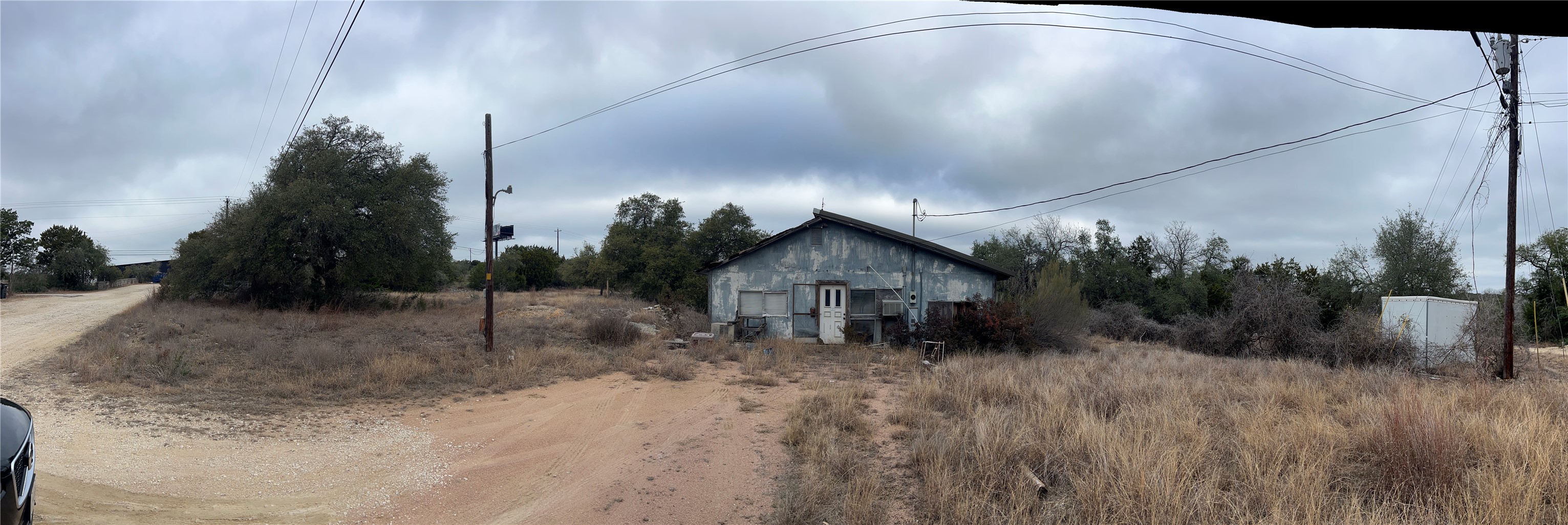 4 Anglin Lane Austin, TX 78737 - Photo 25 of 27 a view of a house with a yard