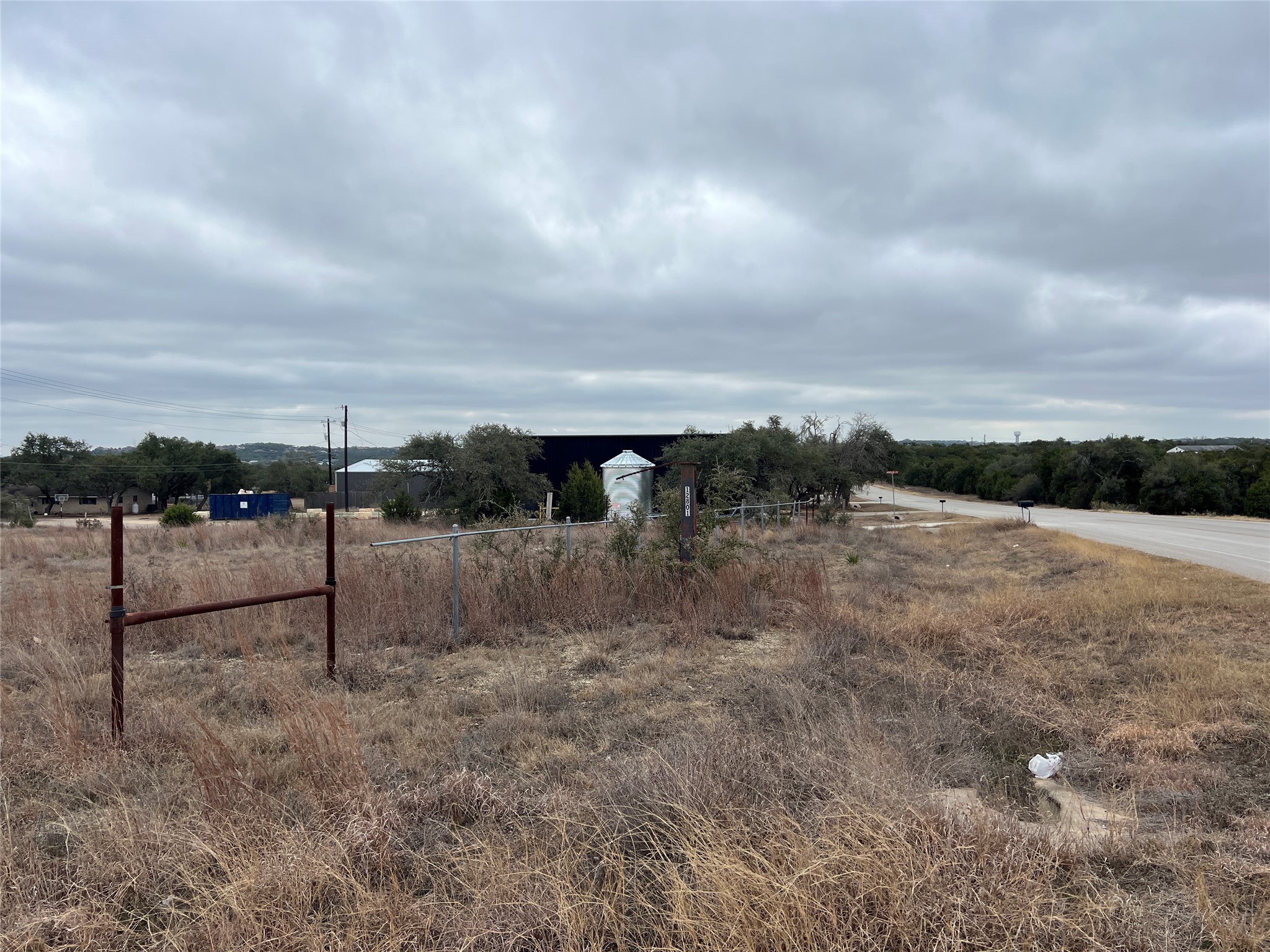 4 Anglin Lane Austin, TX 78737 - Photo 4 of 27 a view of a dry yard with wooden fence