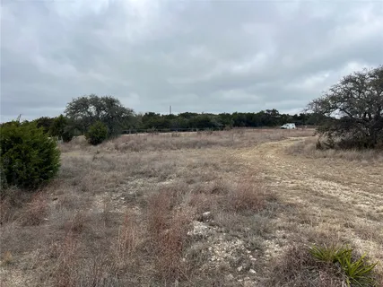 a view of a lake with houses in the back