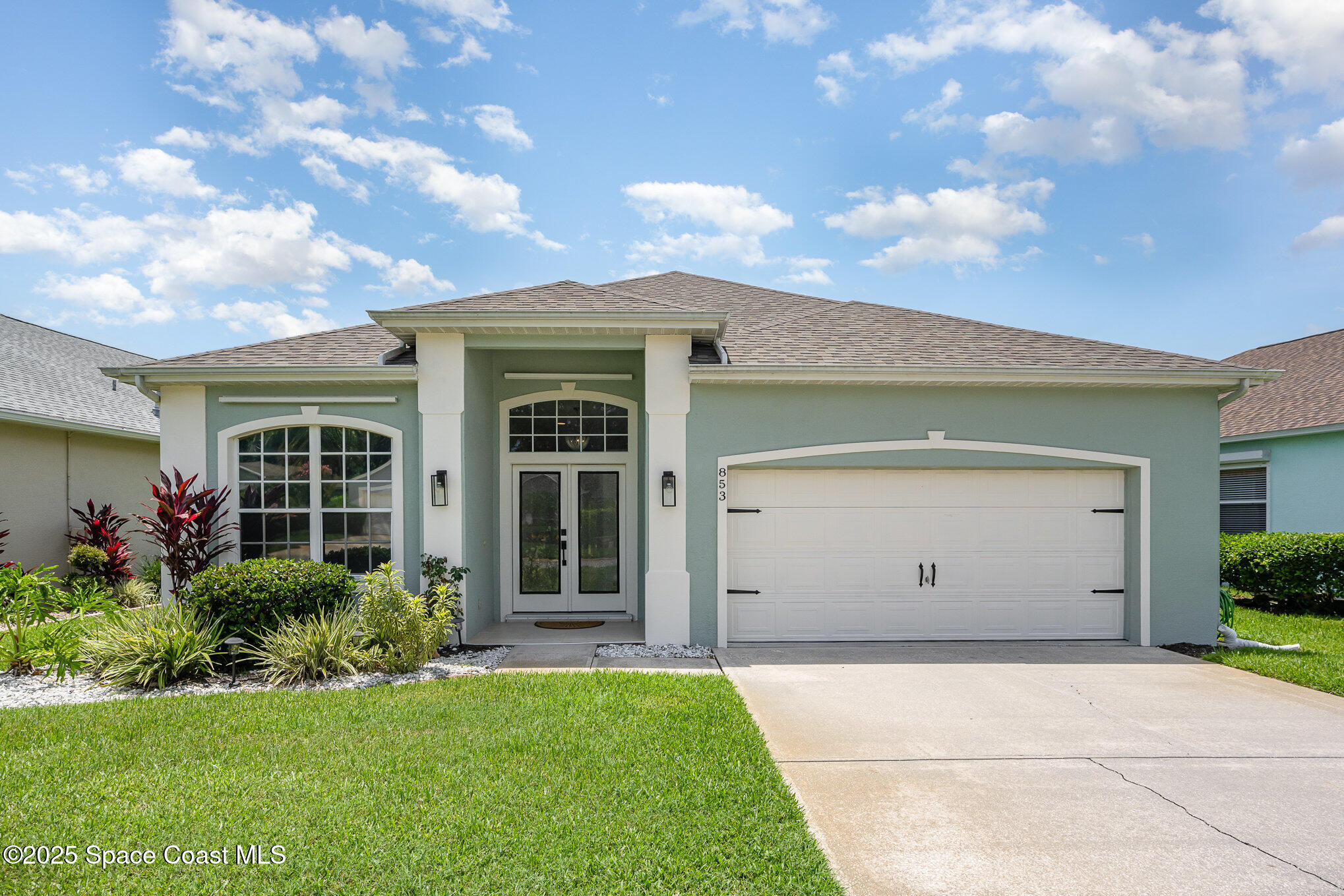 853 Villa Drive Melbourne, FL 32940 - Photo 1 of 26 front view of a house with a garden