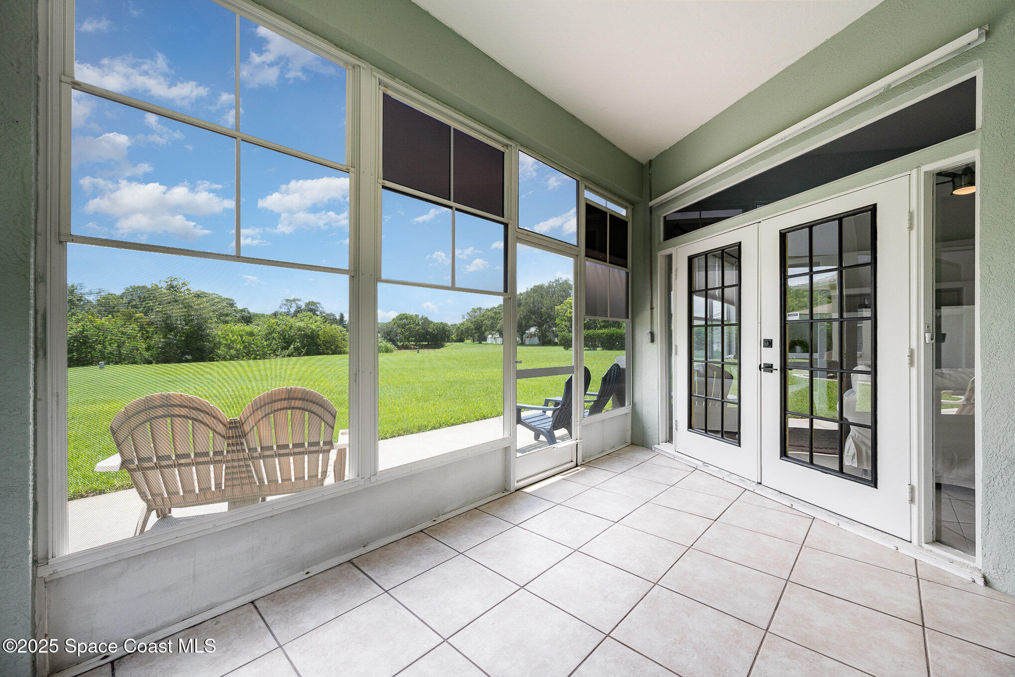 853 Villa Drive Melbourne, FL 32940 - Photo 13 of 26 a view of a porch with furniture and garden