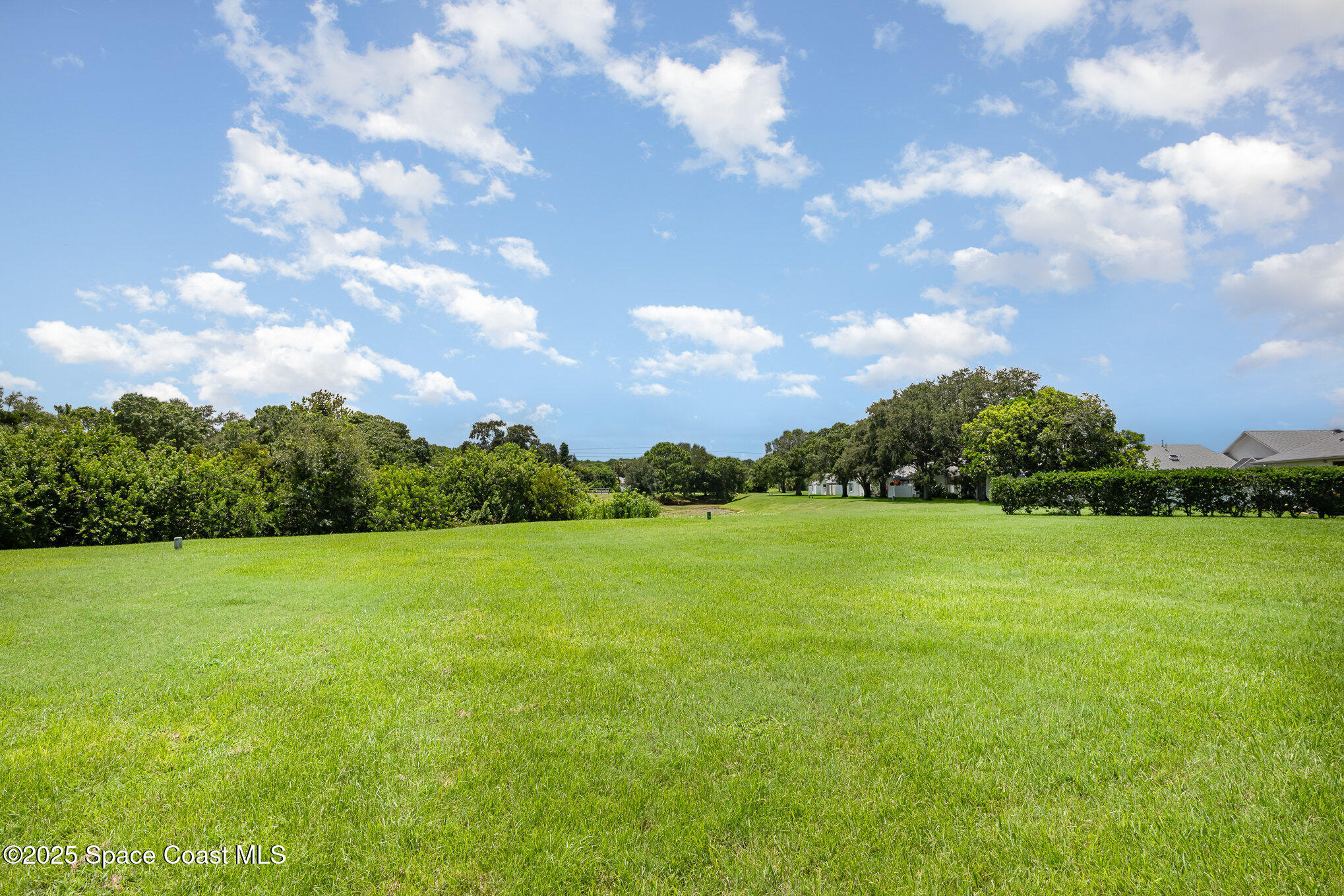 853 Villa Drive Melbourne, FL 32940 - Photo 15 of 26 a view of grassy field with trees