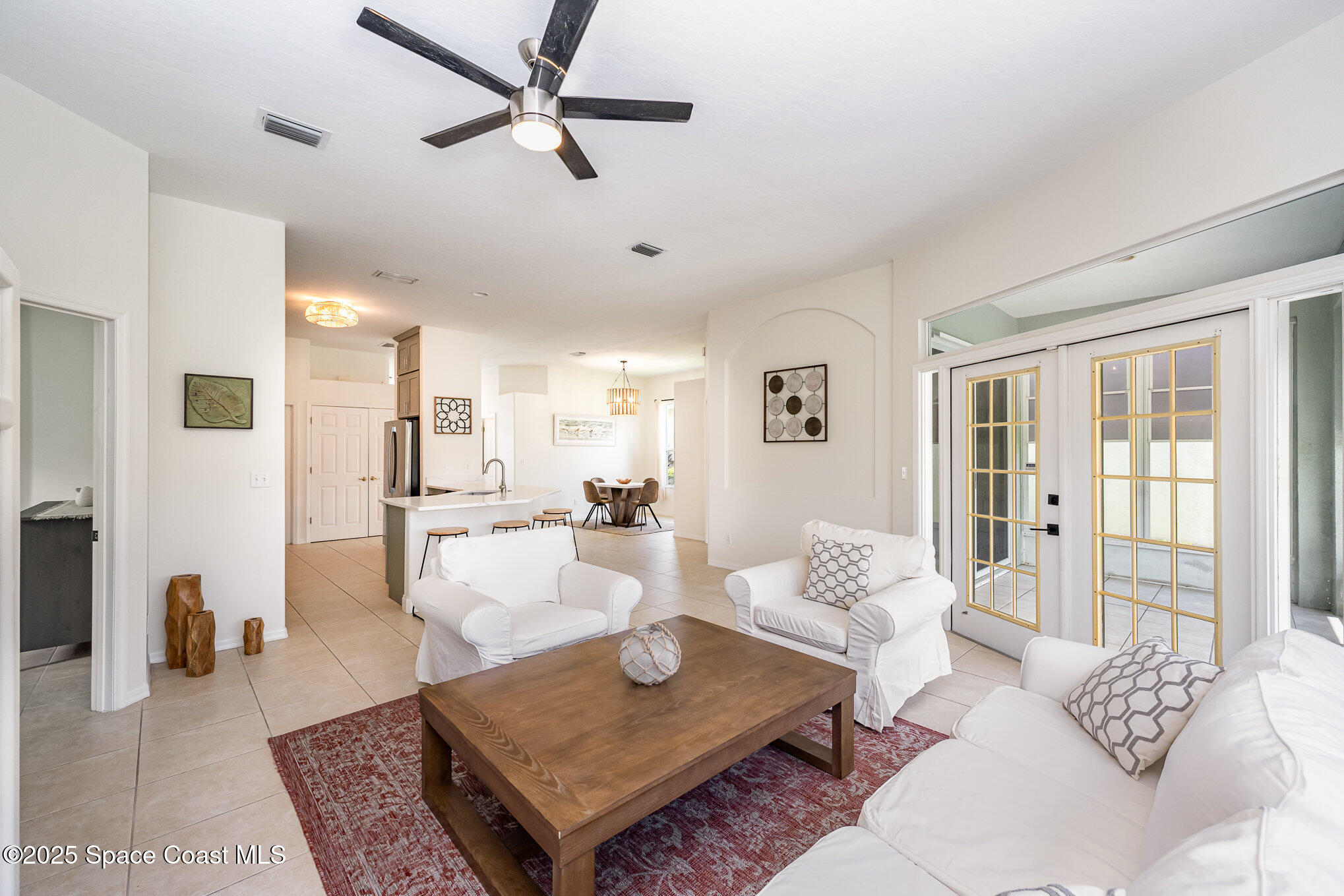 853 Villa Drive Melbourne, FL 32940 - Photo 19 of 26 a living room with furniture and a table
