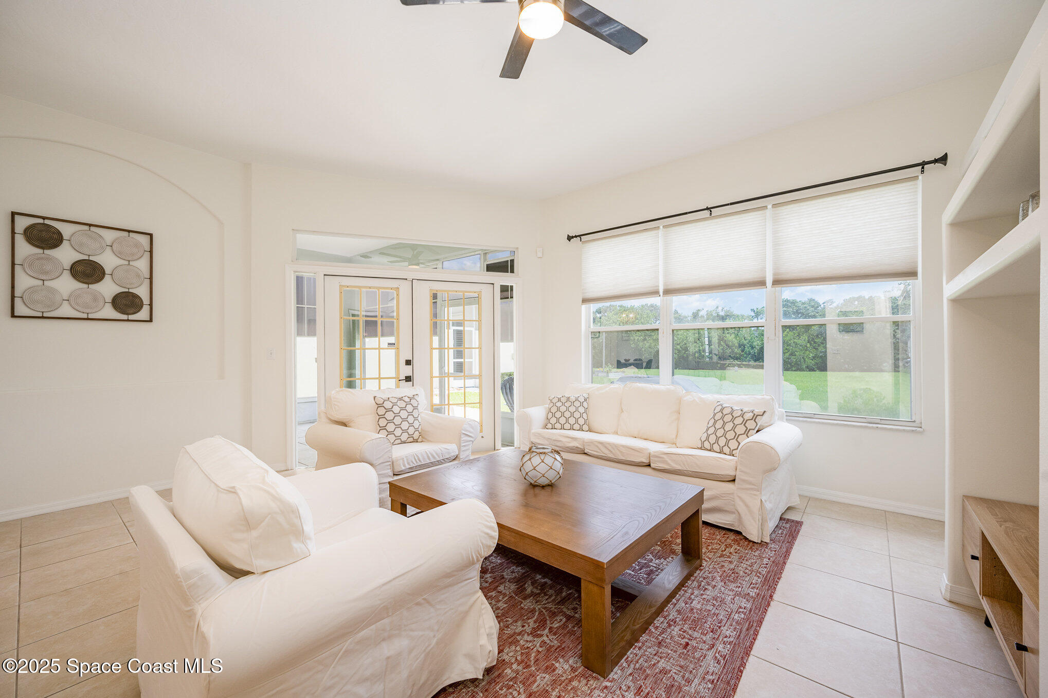 853 Villa Drive Melbourne, FL 32940 - Photo 3 of 26 a living room with furniture and a large window