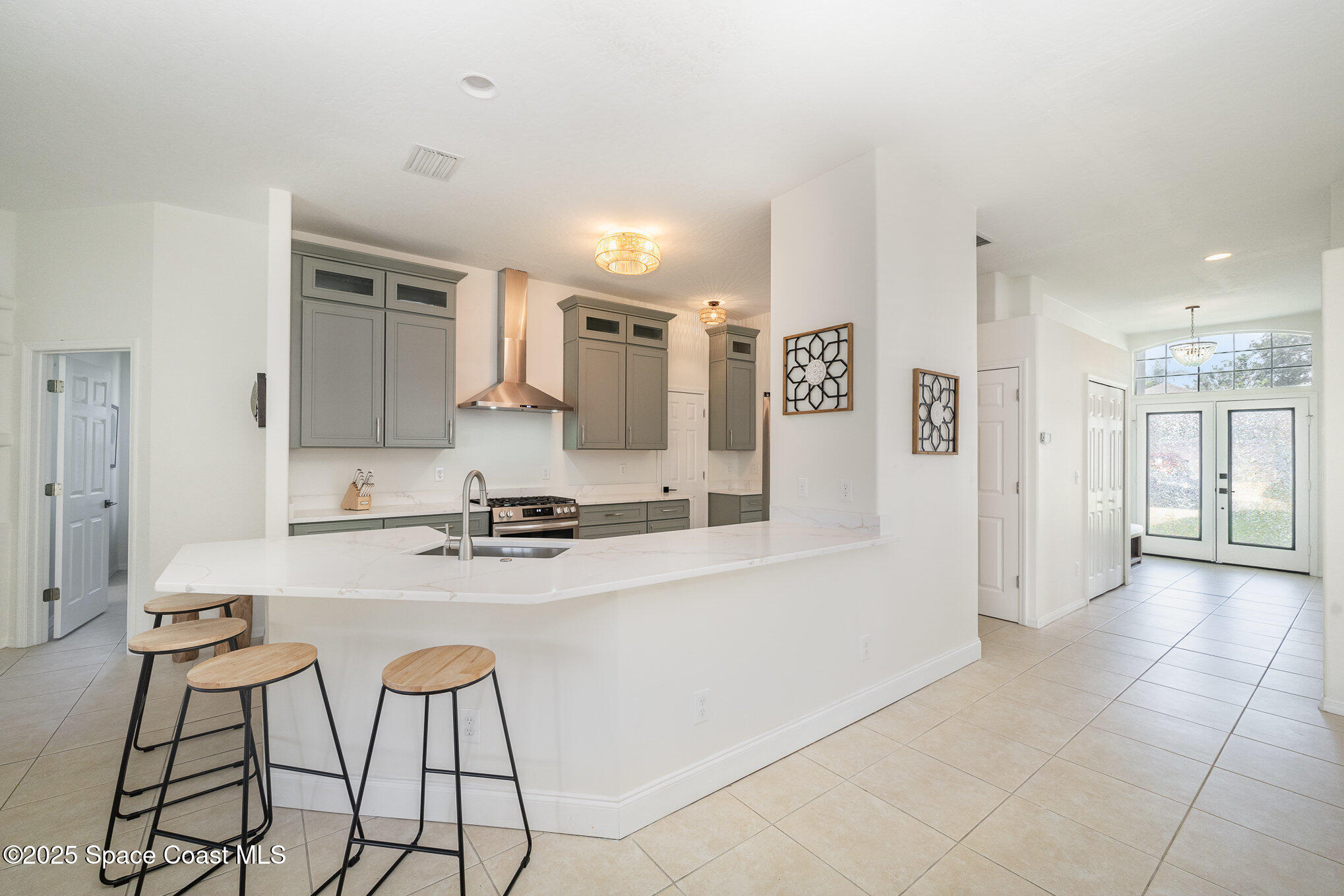 853 Villa Drive Melbourne, FL 32940 - Photo 5 of 26 a large bathroom with a sink and a large mirror