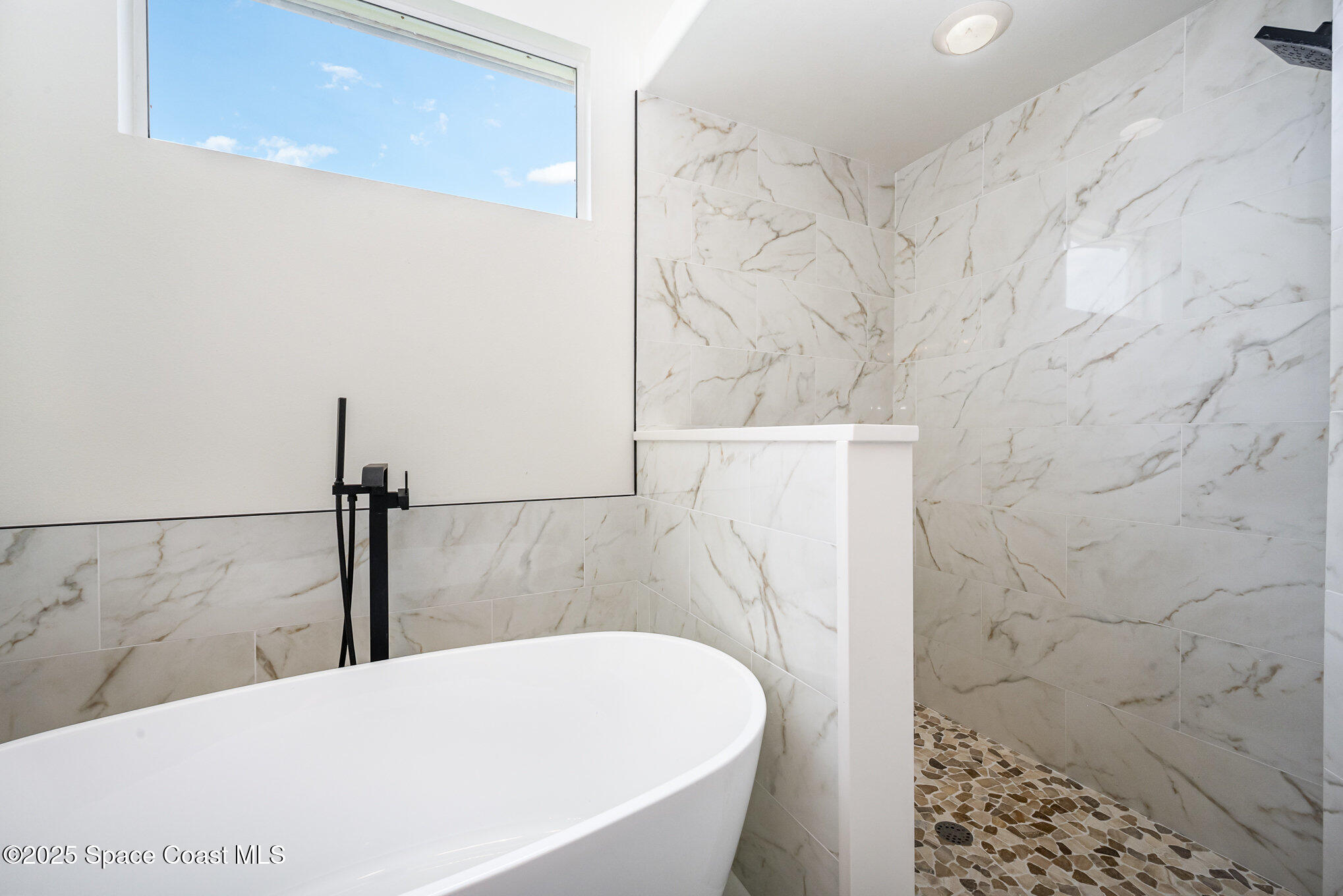 853 Villa Drive Melbourne, FL 32940 - Photo 9 of 26 a bathroom with a bathtub