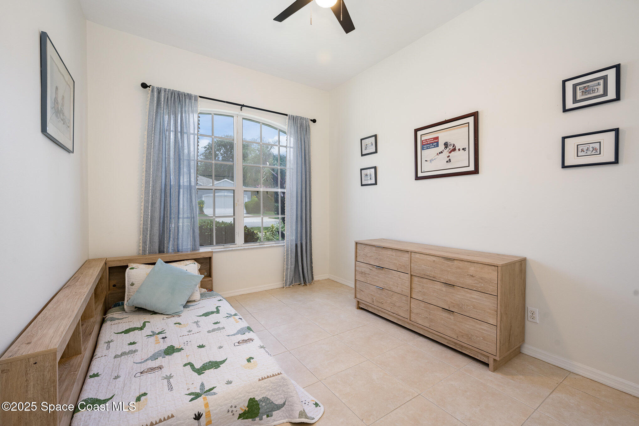 853 Villa Drive Melbourne, FL 32940 - Photo 10 of 26 a bedroom with a bed and a window