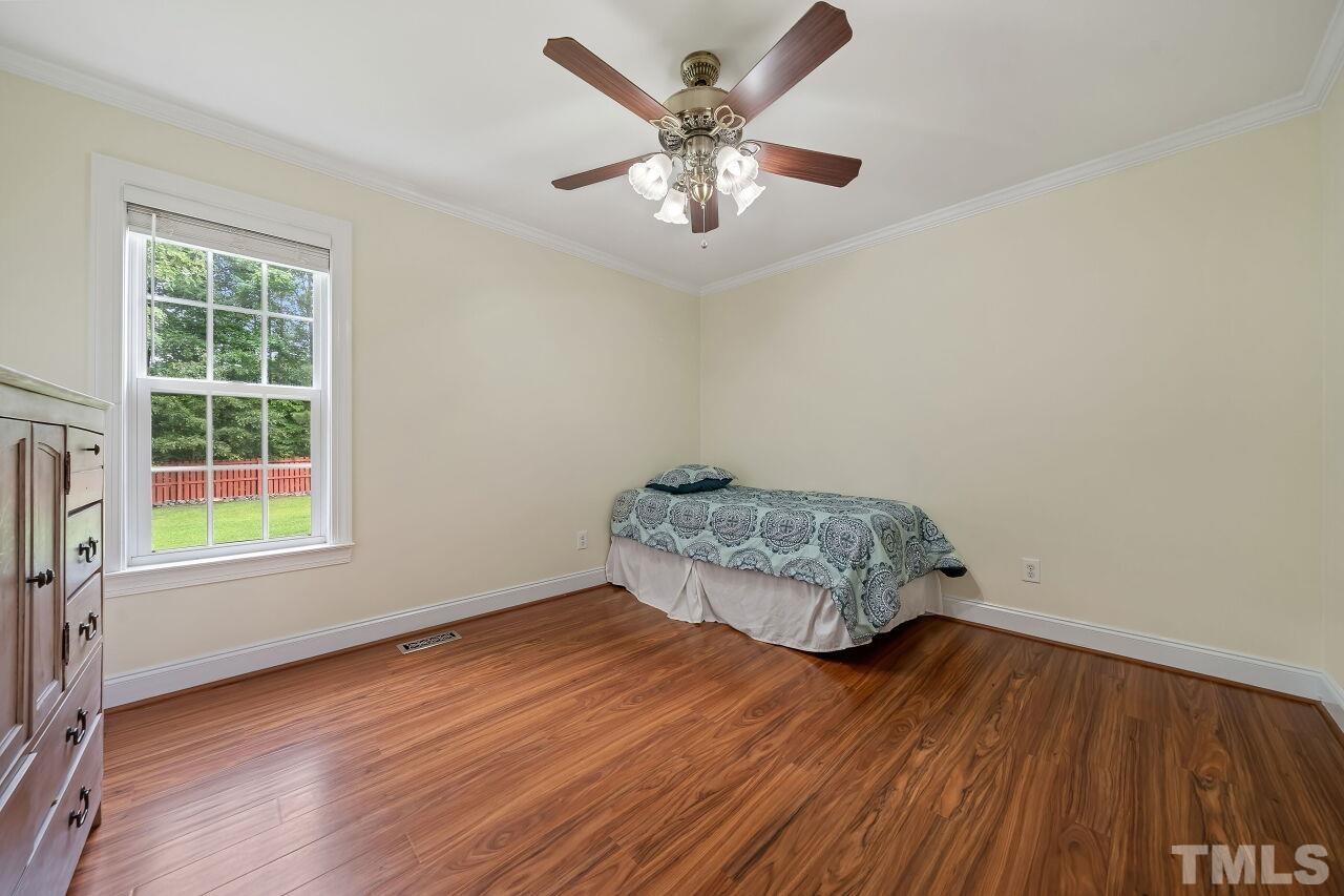 48 Eagle Pointe Lane Clayton, NC 27520 - Photo 16 of 21 an empty room with wooden floor and windows