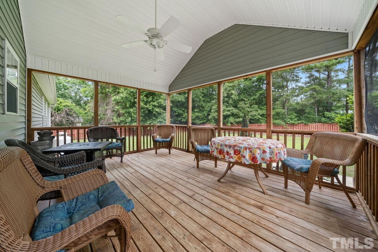 48 Eagle Pointe Lane Clayton, NC 27520 - Photo 18 of 21 a balcony with wooden floor and outdoor seating