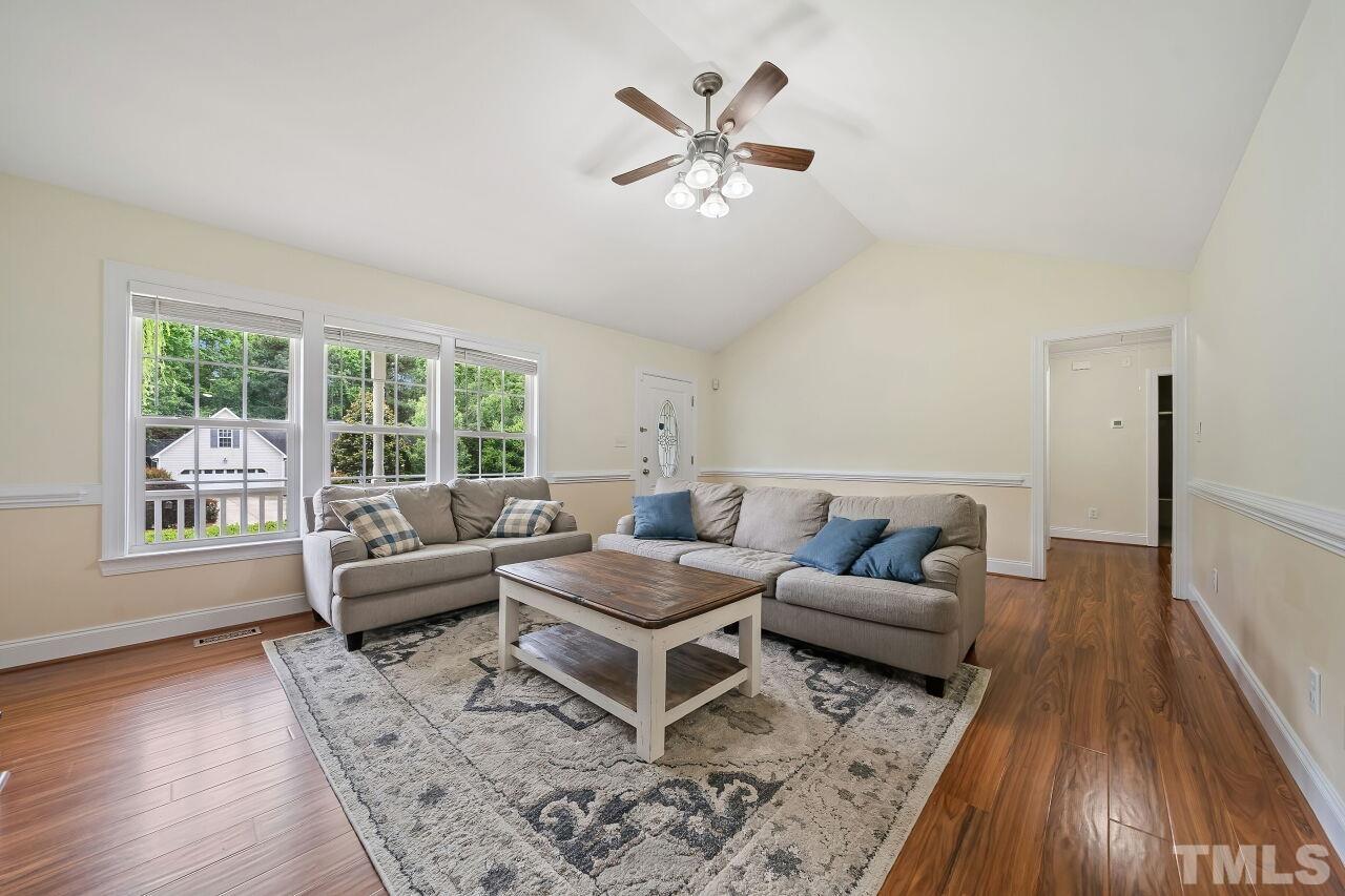 48 Eagle Pointe Lane Clayton, NC 27520 - Photo 4 of 21 a living room with furniture and a large window