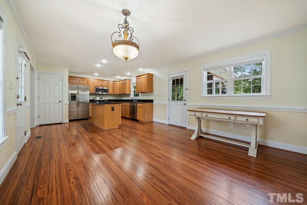 48 Eagle Pointe Lane Clayton, NC 27520 - Photo 5 of 21 a view of kitchen and dining room with wooden floor