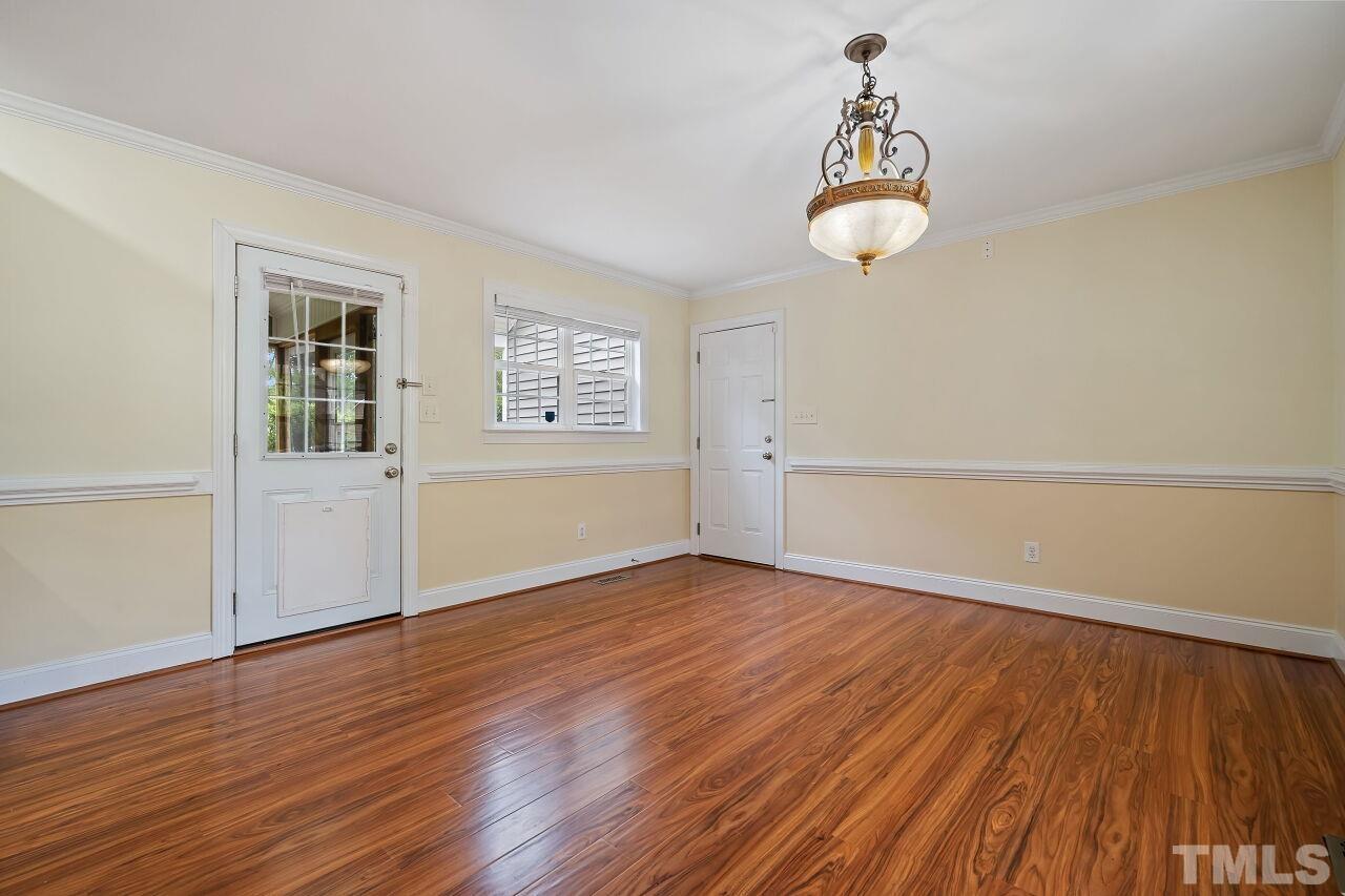 48 Eagle Pointe Lane Clayton, NC 27520 - Photo 8 of 21 wooden floor in an empty room with a window