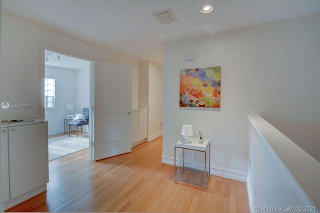 a view of a livingroom with furniture and wooden floor