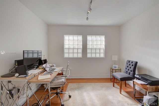 a workspace with furniture and window