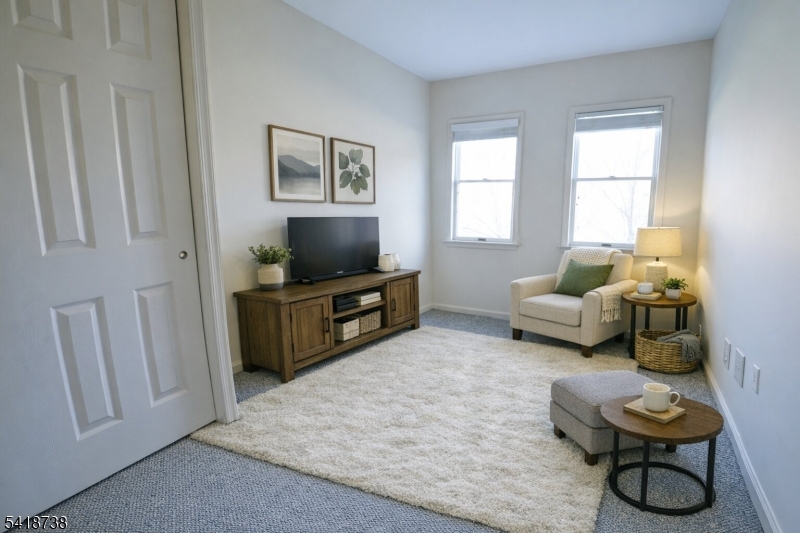 37 Park Edge Berkeley Heights, NJ 07922 - Photo 14 of 25 a living room with furniture and a flat screen tv