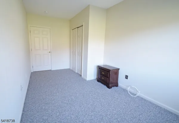 an empty room with furniture