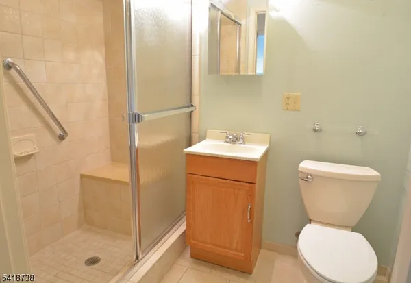 a bathroom with a toilet sink and shower