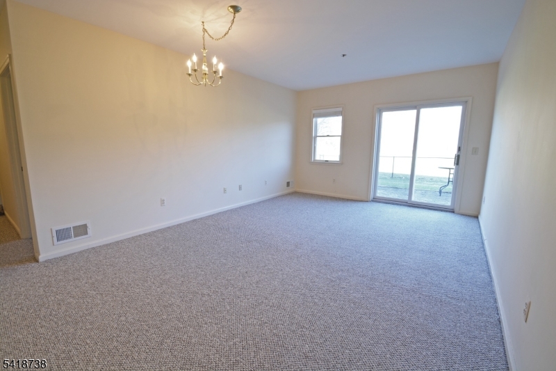 37 Park Edge Berkeley Heights, NJ 07922 - Photo 7 of 25 a view of a big room with windows and chandelier fan