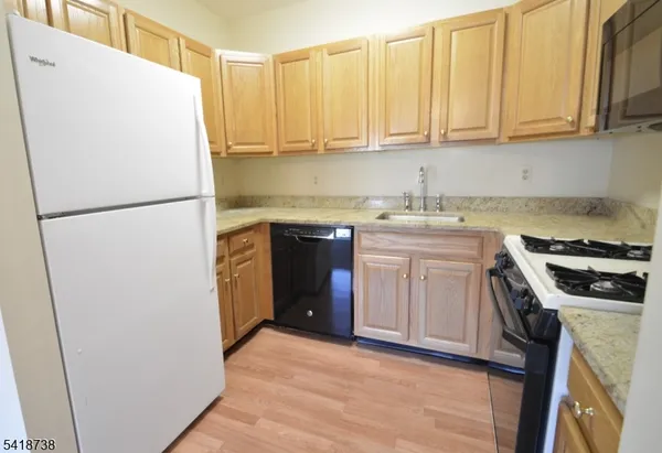 a white refrigerator freezer sitting inside of a kitchen