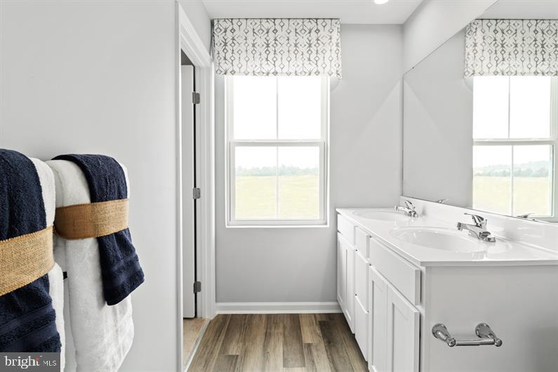 4709 Cooks Hl Road, Unit 39 Lanham, MD 20706 - Photo 13 of 17 a bathroom with a sink and a mirror