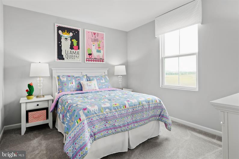 4709 Cooks Hl Road, Unit 39 Lanham, MD 20706 - Photo 14 of 17 a bedroom with a bed a dresser and a window