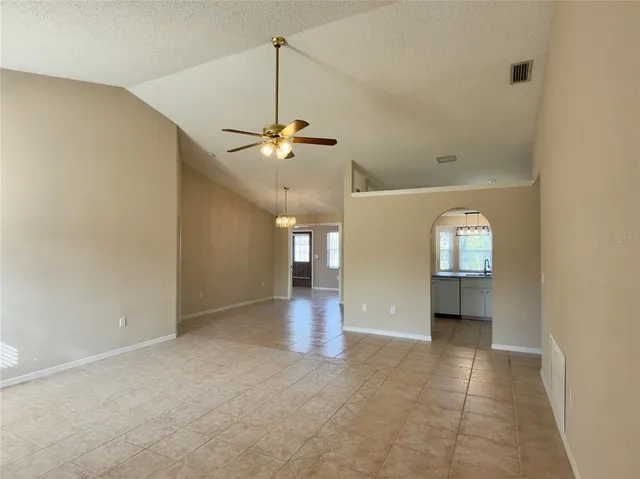 an empty room with a view of a bathroom