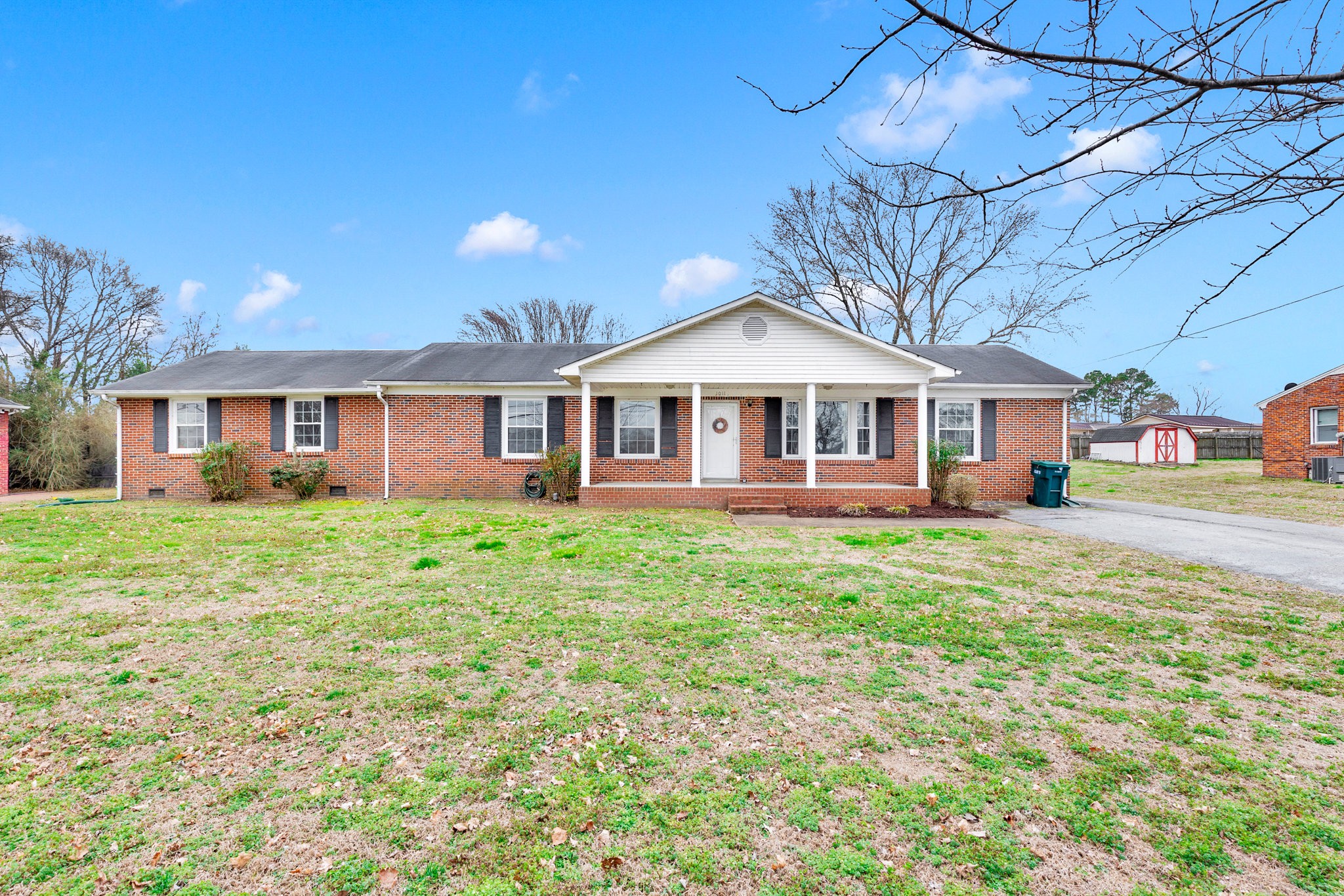 1011 Vales Mill Road Pulaski, TN 38478 - Photo 1 of 32 a front view of a house with a garden
