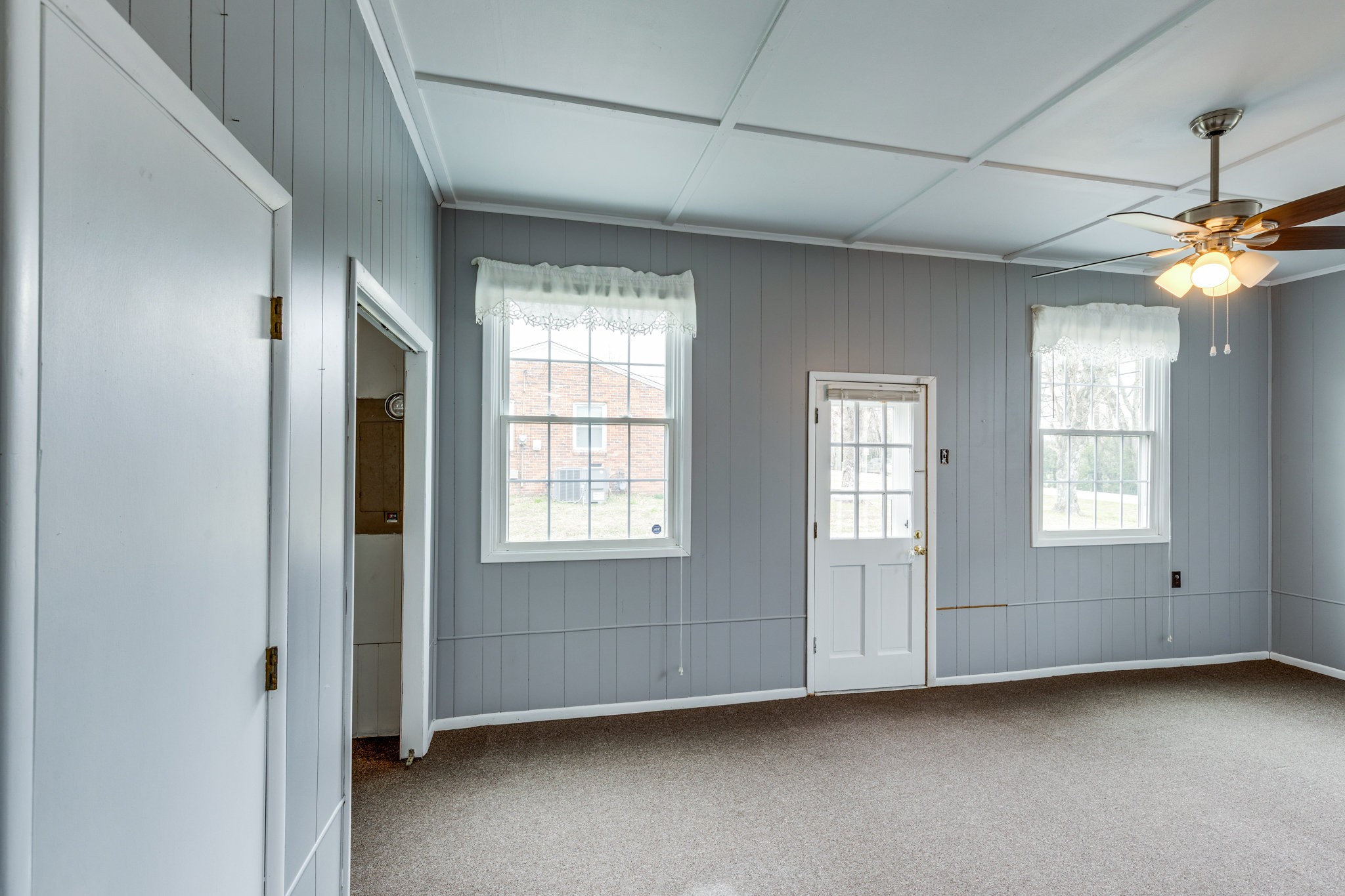 1011 Vales Mill Road Pulaski, TN 38478 - Photo 14 of 32 an empty room with windows and ceiling fan