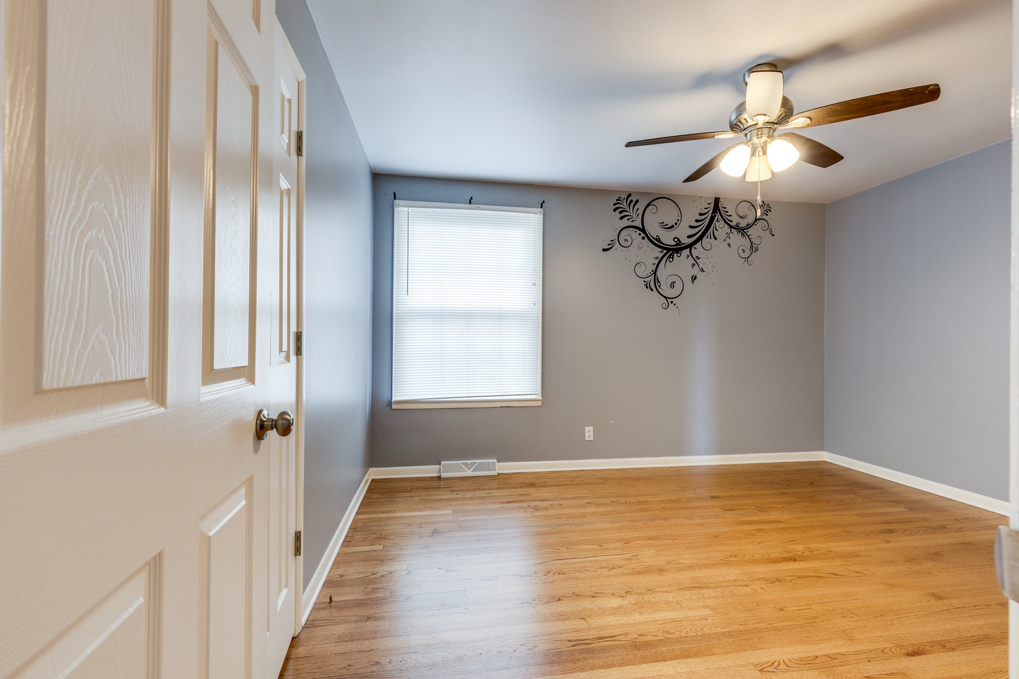1011 Vales Mill Road Pulaski, TN 38478 - Photo 21 of 32 wooden floor in an empty room with a window