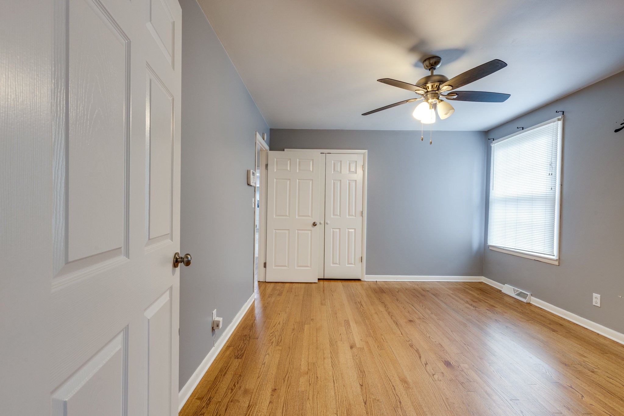1011 Vales Mill Road Pulaski, TN 38478 - Photo 22 of 32 a view of empty room with wooden floor and fan