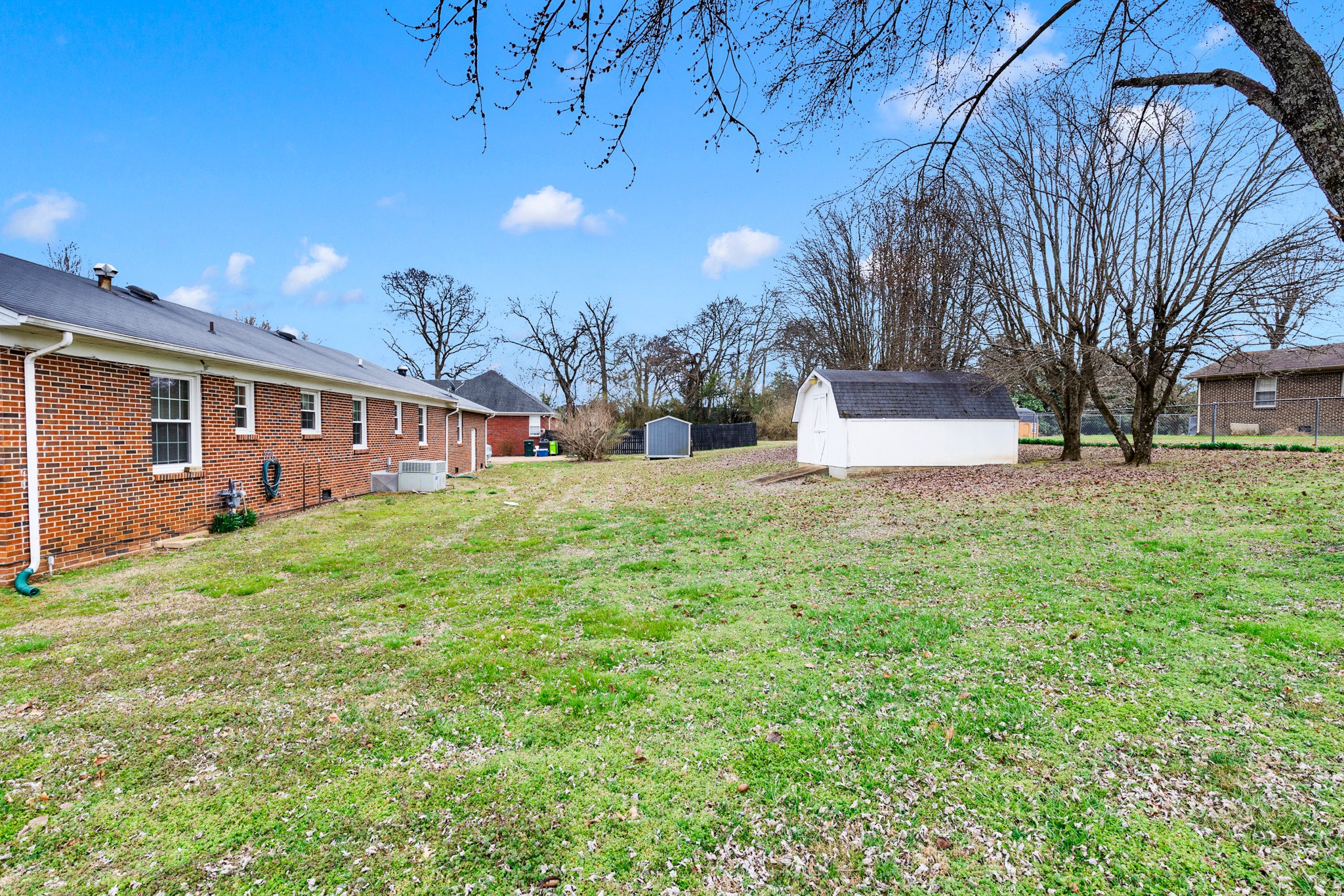 1011 Vales Mill Road Pulaski, TN 38478 - Photo 30 of 32 a view of a yard with a house in the background