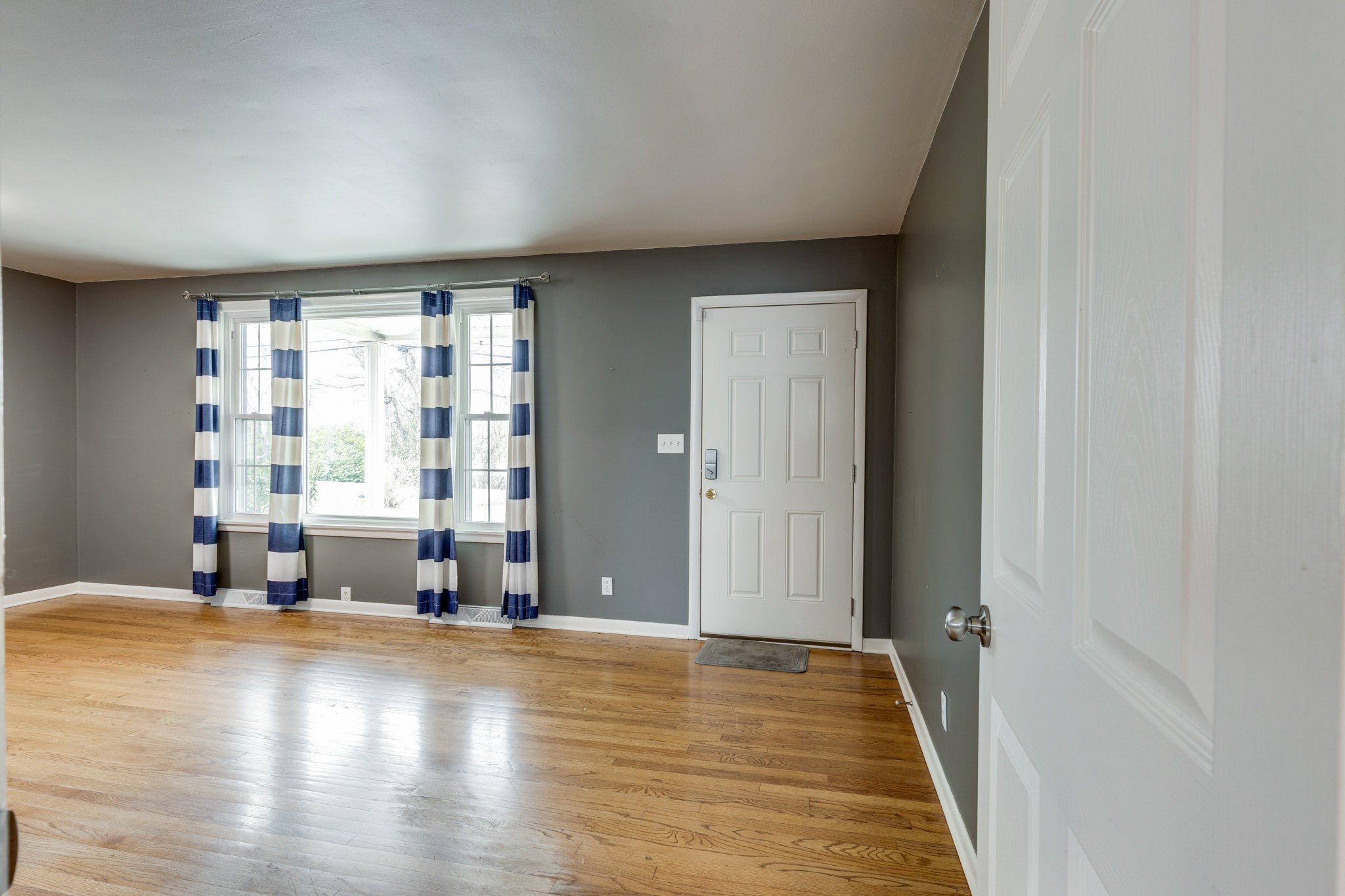 1011 Vales Mill Road Pulaski, TN 38478 - Photo 4 of 32 wooden floor in an empty room with a window