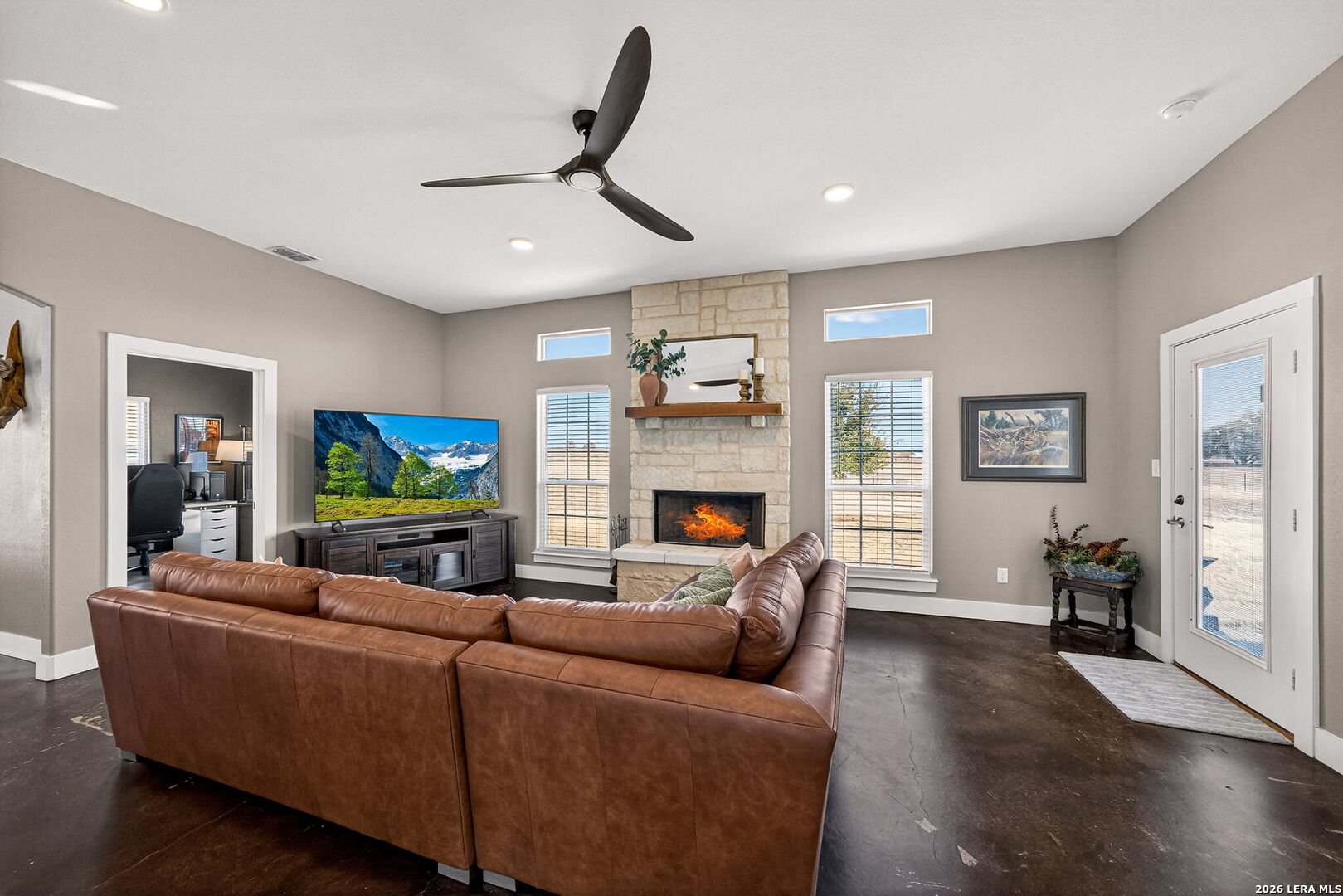 932 County Road 761 Devine, TX 78016 - Photo 11 of 47 a living room with furniture and a flat screen tv