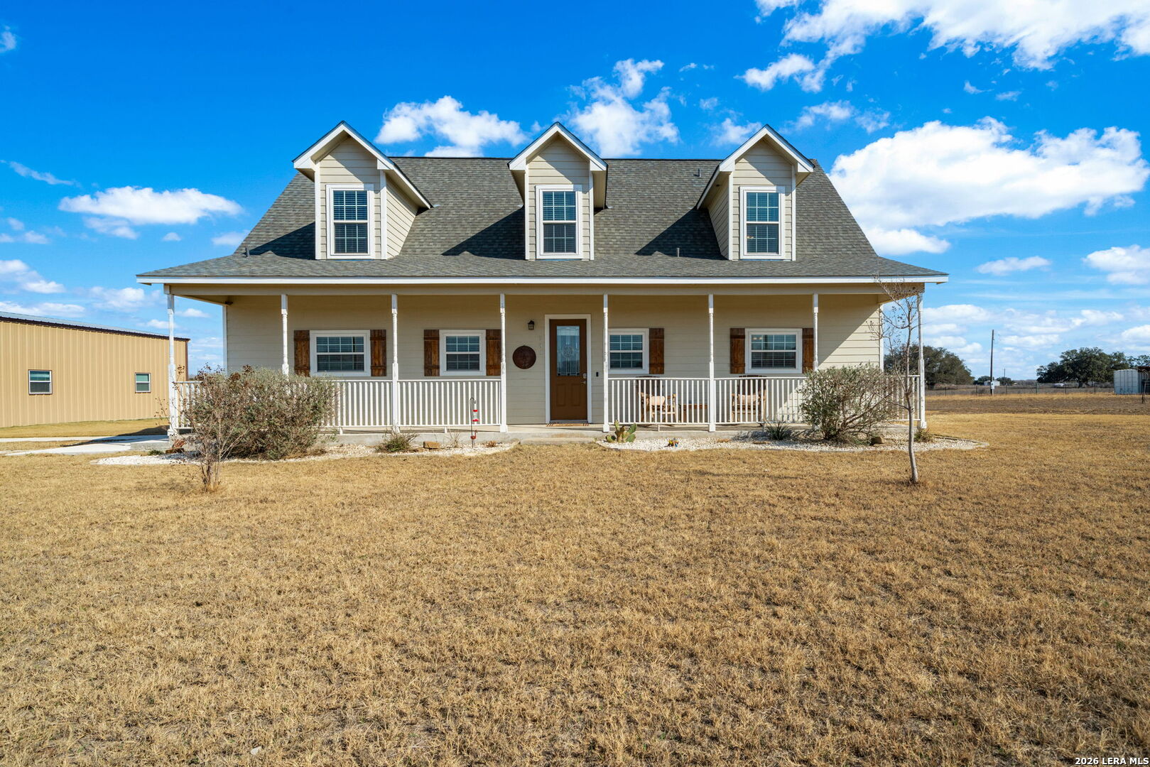 932 County Road 761 Devine, TX 78016 - Photo 2 of 47 front view of a house with a yard