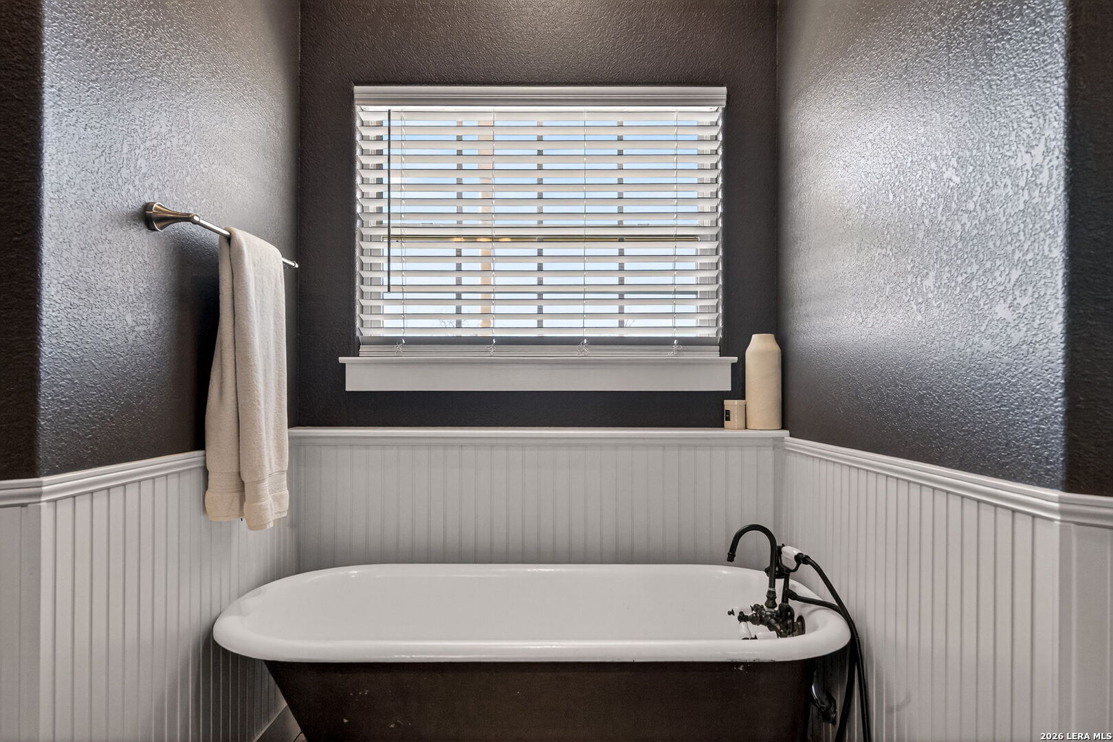 932 County Road 761 Devine, TX 78016 - Photo 24 of 47 a bathroom with a sink and a window