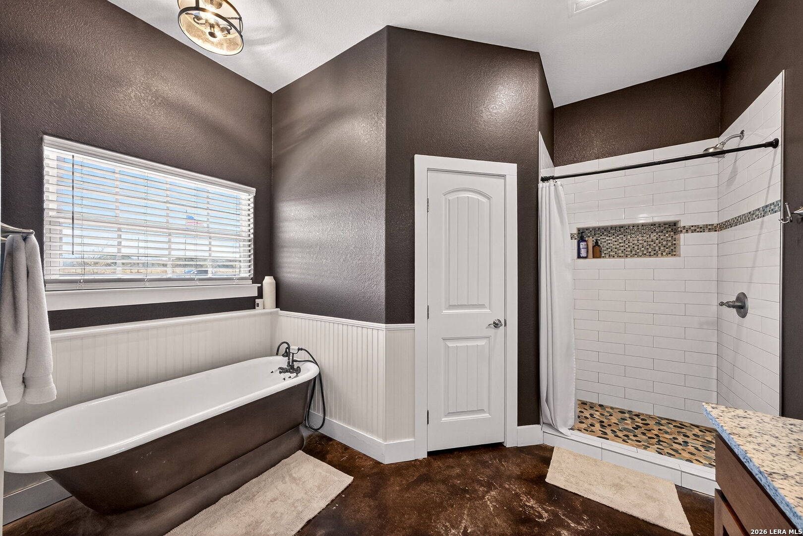 932 County Road 761 Devine, TX 78016 - Photo 25 of 47 a bathroom with a bathtub and a shower