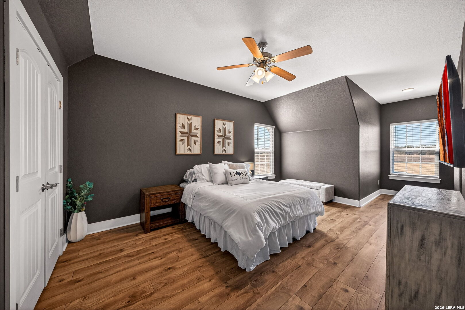932 County Road 761 Devine, TX 78016 - Photo 26 of 47 a bedroom with a bed and a chandelier