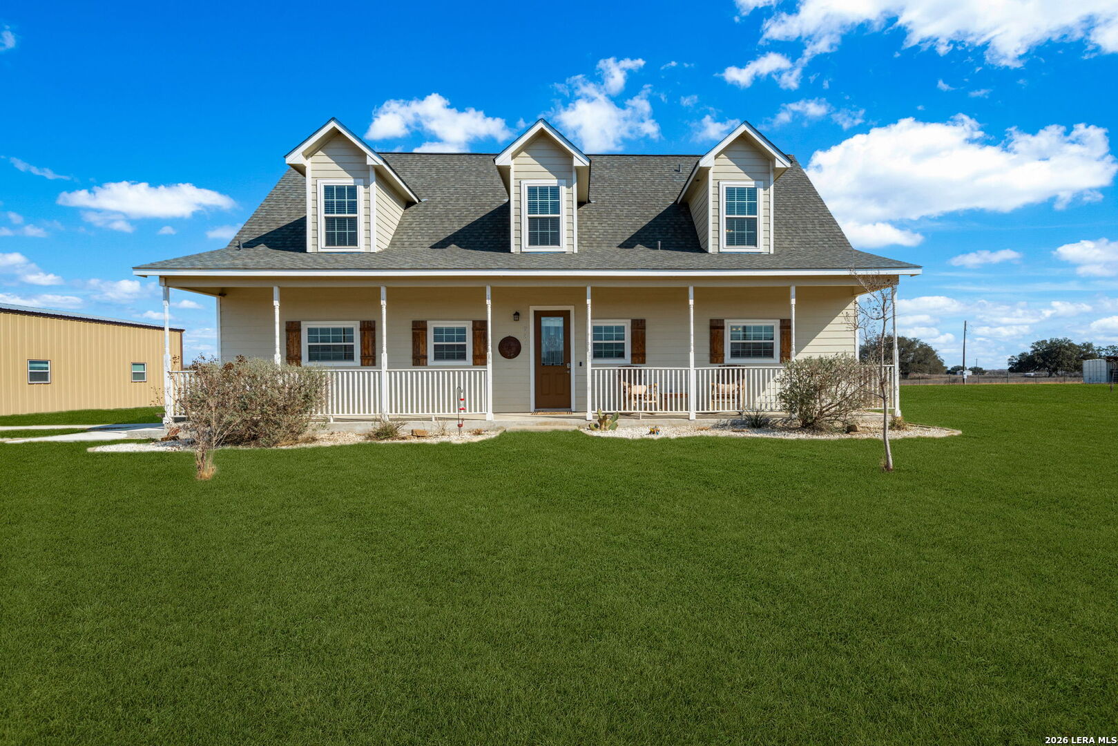 932 County Road 761 Devine, TX 78016 - Photo 3 of 47 front view of a house with a yard