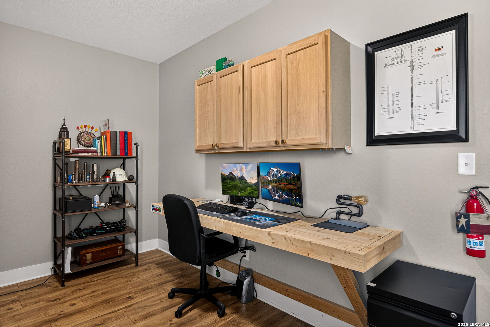 932 County Road 761 Devine, TX 78016 - Photo 31 of 47 a view of a workspace with furniture and wooden floor