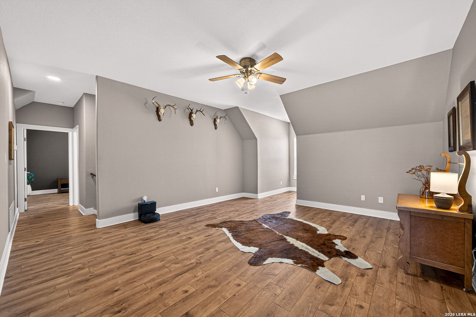 932 County Road 761 Devine, TX 78016 - Photo 33 of 47 a view of livingroom with hardwood floor and a ceiling fan
